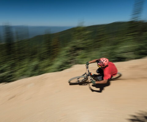 Berms are the name of the game on Kashmir. Travis Adams keeps his eyes up and his speed high while ripping into one of the trail's signature features. NIKON 1/150 sec, f/14, ISO 80