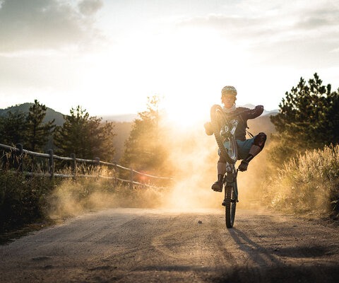 Joey Schusler pops a celebratory wheelie after finishing the Colorado Megaride, an event he organizes at the end of summer every year. It lives up to its name: The multi-day trip goes from Nederland, CO, over the Continental Divide to Winterpark, and then back to Boulder, and is one hell of a way to close out the season.