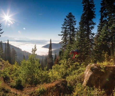 Teton Pass’ Fuzzy Bunny Trail might sound cute and fluffy, but there are plenty of moves that can eat even experienced riders. Andrew Whiteford risks life and limb while sending one of the trail’s many gaps, just as the fog rolls into the valley below.