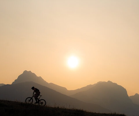 Dave Kinn rides through forest fire smoke in Canmore, Alberta. Canada’s climate is warming at a more rapid rate than most other places in the world. Photo: John Gibson