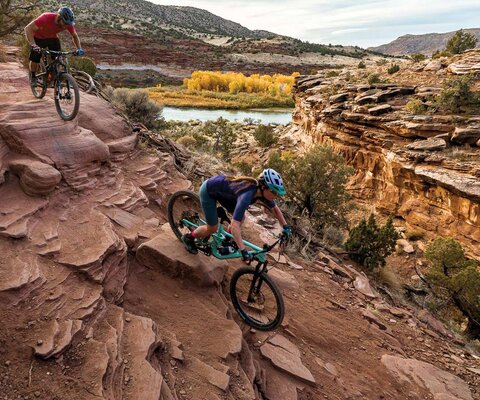 Sienna and Trevor Martin take in the fading colors of fall as they drop into one of the more popular sections of the Horsethief Bench trail. SONY, 1/500 sec, f/5.6, ISO 250