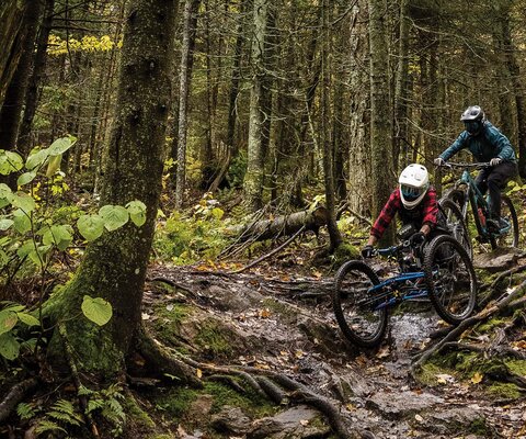 Greg Durso leads Adam Morse down One Love, a black-diamond ribbon of spiderweb roots at the Bolton Valley Resort. Bolton Valley embraced its preexisting community-built tech trails to successfully bring some of Vermont’s most challenging riding to the masses.  NIKON, 1/640 sec, f/5, ISO 2000