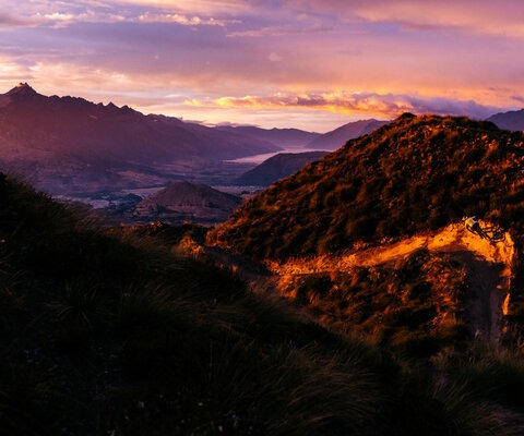 Kelsey Timpany takes in the sunrise on Rude Rock.