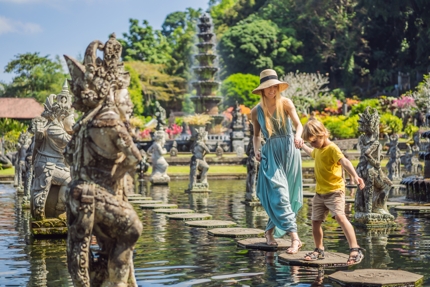 Tourists in Tirta Gangga, a former royal palace in Bali