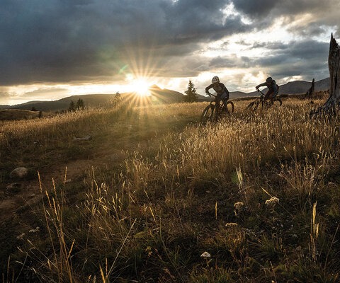 Jen Zeuner chases Sarah Sturm as the last evening light fades on the Colorado Trail at Molas Pass north of Durango. SONY, 1/320 sec, f/11, ISO 3200